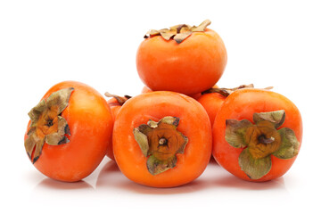 fresh persimmons on white background .