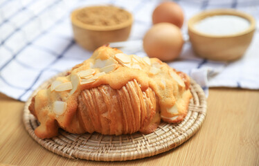 fresh baking almond croissant from homemade bakery cooking. fresh baked for good health care eating lifestyle.