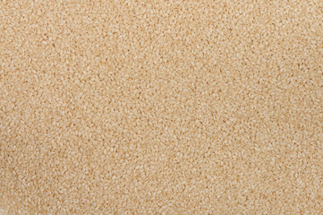 Fototapeta na wymiar White sesame seeds background texture