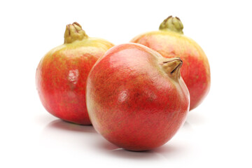 Ripe pomegranate fruit isolated on white background
