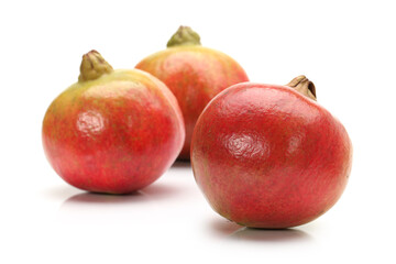 Ripe pomegranate fruit isolated on white background