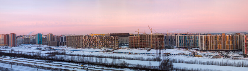 dawn over a construction site in the city