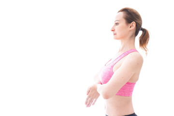 Obraz premium ヨガをするスポーツウェアを着た若い女性