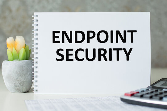 Text ENDPOINT SECURITY on brown paper notepad in businessman hands in office. Business concept