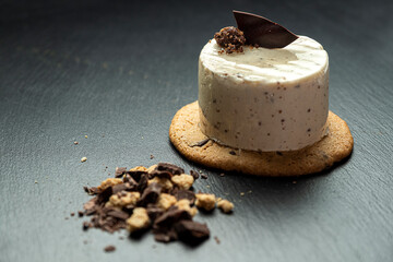 homemade vanilla and cookies cake dessert, on an elegant background.