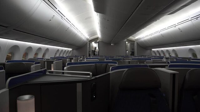 Dolly across the first class cabin and seats of a 787 widebody commercial passenger airplane.