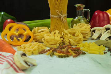 Dry and cheesy pasta with vegetables on the table