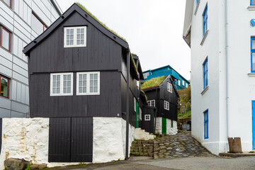Fototapeta na wymiar Narrow street with typical houses in Thorshavn on the Streymoy Island. Faroe Islands.