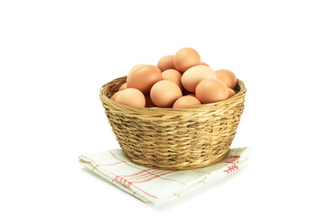 Fresh chicken eggs in a wicker basket