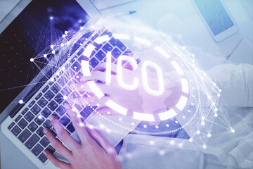 Double exposure of woman hands working on computer and blockchain theme hologram drawing. Top View....