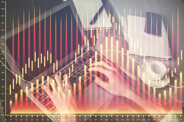 Double exposure of woman hands typing on computer and forex chart hologram drawing. Stock market...