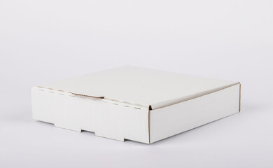 Naklejka premium pizza box standing on a white background