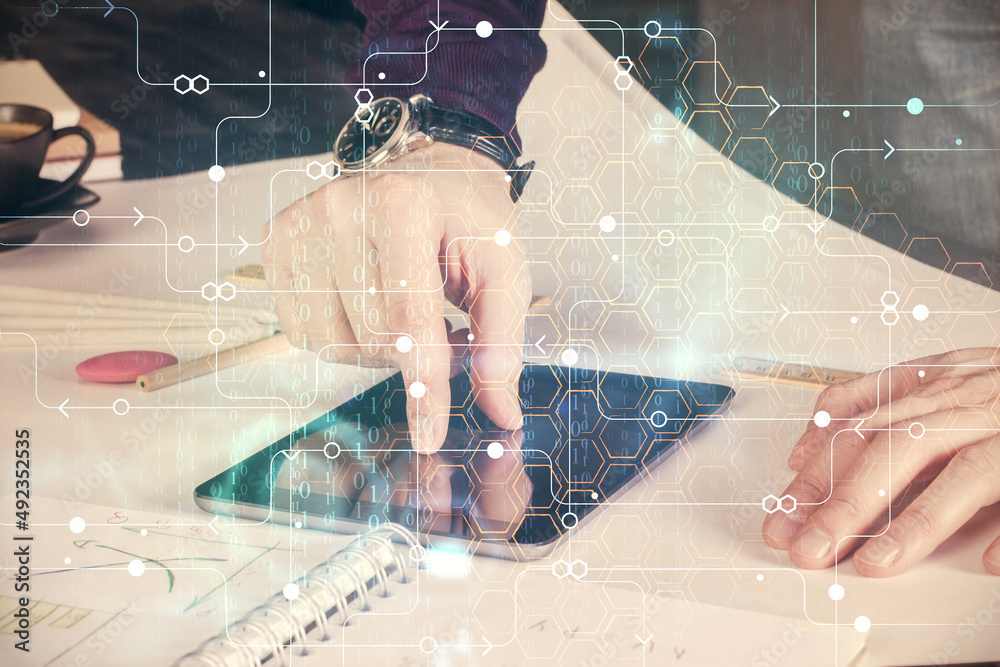 Poster Double exposure of man's hand holding and using a digital device and data theme drawing. Technology concept.