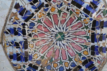 Broken multicolored glass background texture, ceramic tile in park Guell, Barcelona, Spain