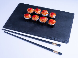 shrimp nigiri and sauce sushi on black background. Close Up of delicious japanese food with sushi roll.