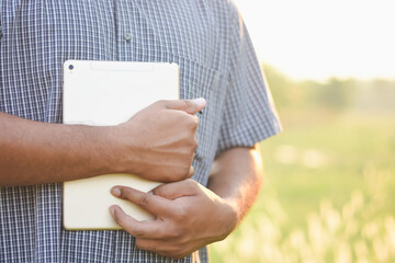 Businessman's hand using a tablet to check information