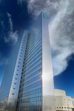 D&uuml;sseldorf, Germany - March 9. 2022: Low angle view on tall shiny thyssen Dreischeibenhaus skyscraper against spectacular blue sky
