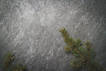 Black background with cones and spruce branches. Christmas black background.