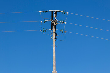 electric pole with a blue sky
