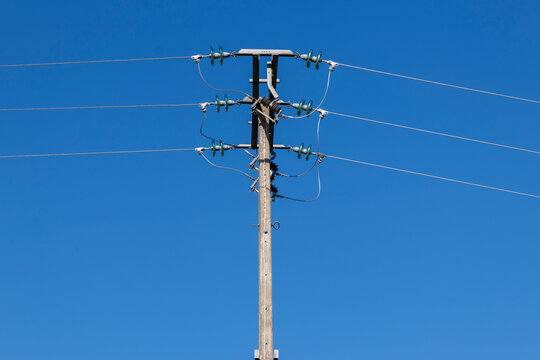 electric pole with a blue sky