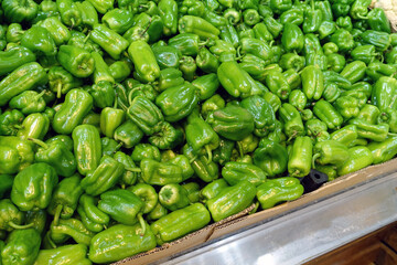 bell pepper in the greengrocer aisle, fresh bell peppers on sale,