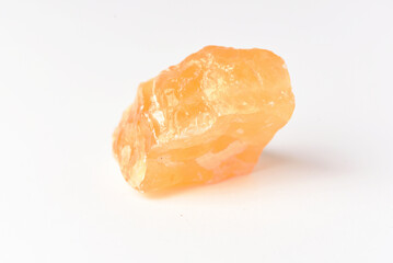 corundum stone  on a white background. yellow.