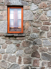 A window isolated on rough stonewall, space for your text or logo