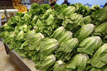 large lettuces for sale at the grocery store, fresh lettuces great for salads,