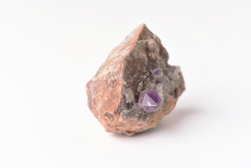 amethyst crystal grown on another stone ,marble, granite,