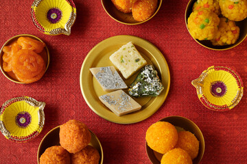 Diwali sweets pista barfi barfee Motichoor Laddu peda badam pak Indian sweet mithai festival dish...