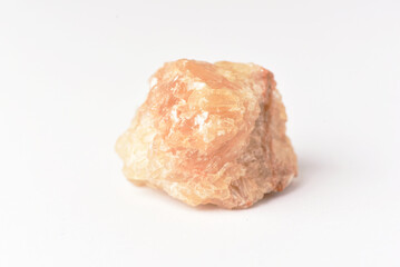 One  uncut and rough Sunstone crystal,quartz on white