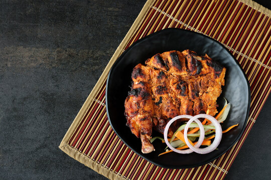 Arabian grilled chicken also called Al Faham or Alfaham or Djaj very popular recipe in Middle East. made using mix Bezar spices and barbeque in a charcoal grill or in oven.