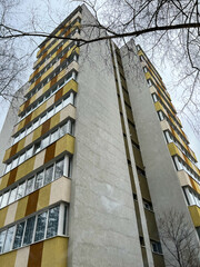Vertical image, old, renewed tower apartment building in Romania.