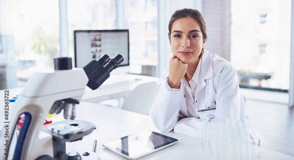 Poster confidence comes with hard work. portrait of a confident young female scientist striking a pose whil