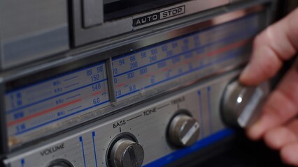 Obraz premium Fashion of the 90s. Vintage tape recorder from the 90s. Tuning analog radio dial frequency on scale