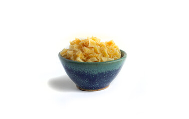 Dried Potato in Blue Pottery Bowl Isolated on White