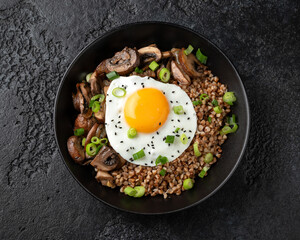 Bowl of Buckwheat with mushrooms, onion and egg. Healthy food