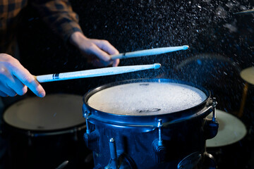 close up  hand of man musician playing on drums in music studio