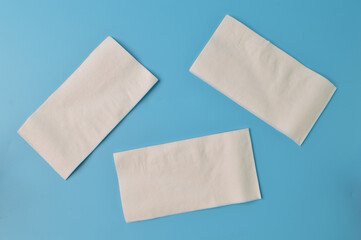 White tissue papers isolated on a blue background