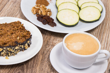 Fresh baked pastry made of zucchini and cup of white coffee. Delicious dessert