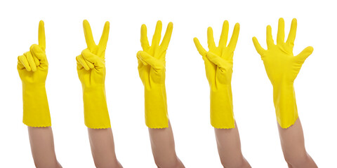 hands in yellow gloves show one, two, three, four, five fingers isolated on white background