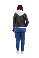 back view of young woman posing in jeans, hoodie and black leather jacket isolated on white