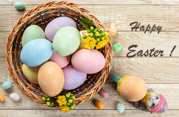 Easter eggs in a basket on a wooden table