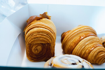 Croissant set in a paper box looks appetizing