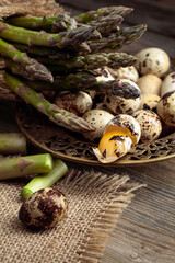 Raw asparagus and quail eggs.