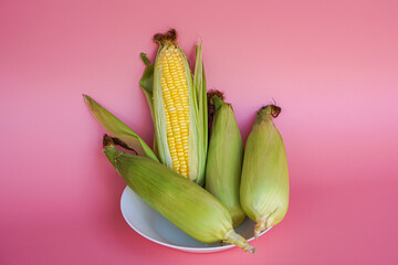 Close-up of fresh sweet corn on table
