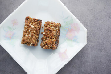 date fruit chocolate bar in a plate on table 