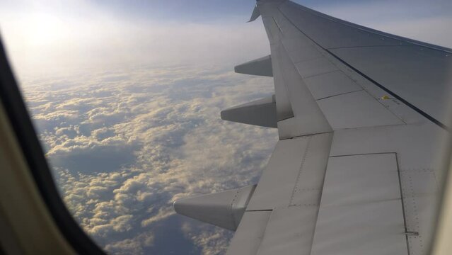 Airplane flight above the clouds in 4K