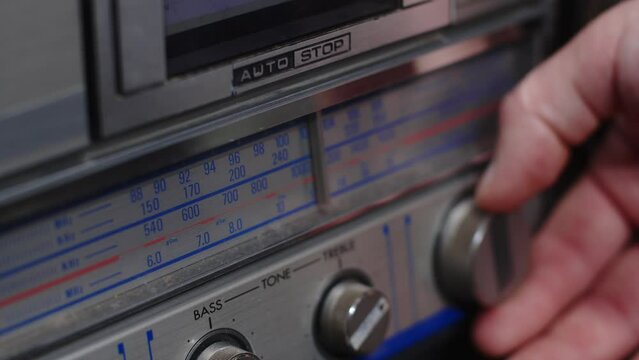 Fashion of the 90s. Vintage tape recorder from the 90s. Tuning analog radio dial frequency on scale