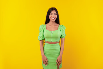 Obraz premium Portrait of happy young woman posing at studio